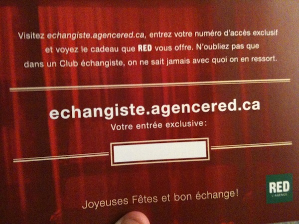 Photo du derrière de la carte postale. Il est écrit: Visitez echangiste.agencered.ca, entrez votre numéro d’accès exclusif et voyez le cadeau que RED vous offre (...)